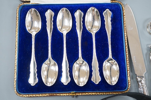 A cased set of six silver teaspoons, a silver bread knife, two 925 pill boxes, an 800 and enamel 'Tutankhamun' pencil case and a silver condiment spoon.